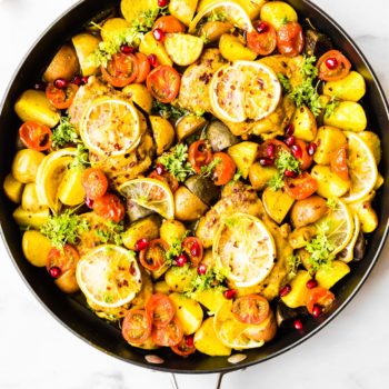 Pan roasted chicken thighs with Persian spices, a burst of lemon flavor and tender veggies! This Persian Spiced Pan Roasted Chicken is an easy one pan meal that comes together in just 45 minutes. Gluten free, grain free, Whole30 and Paleo options!