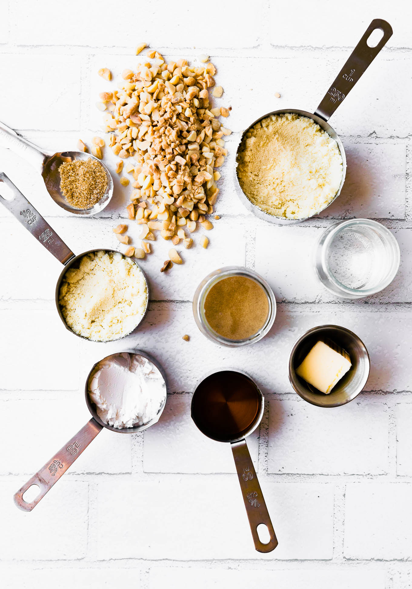 ingredients for maple bars arranged together in measuring cups and spoons.