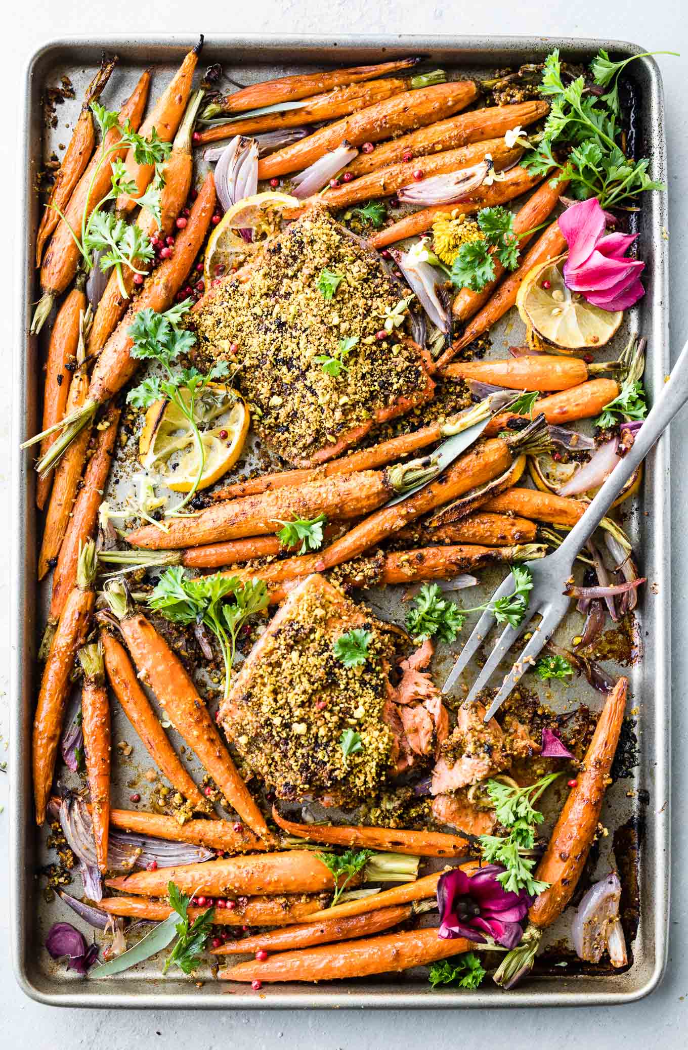 sheet pan dinner of pistachio crusted salmon and glazed carrots