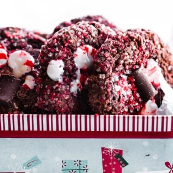 Side view chocolate chunk peppermint cookies in Christmas box.