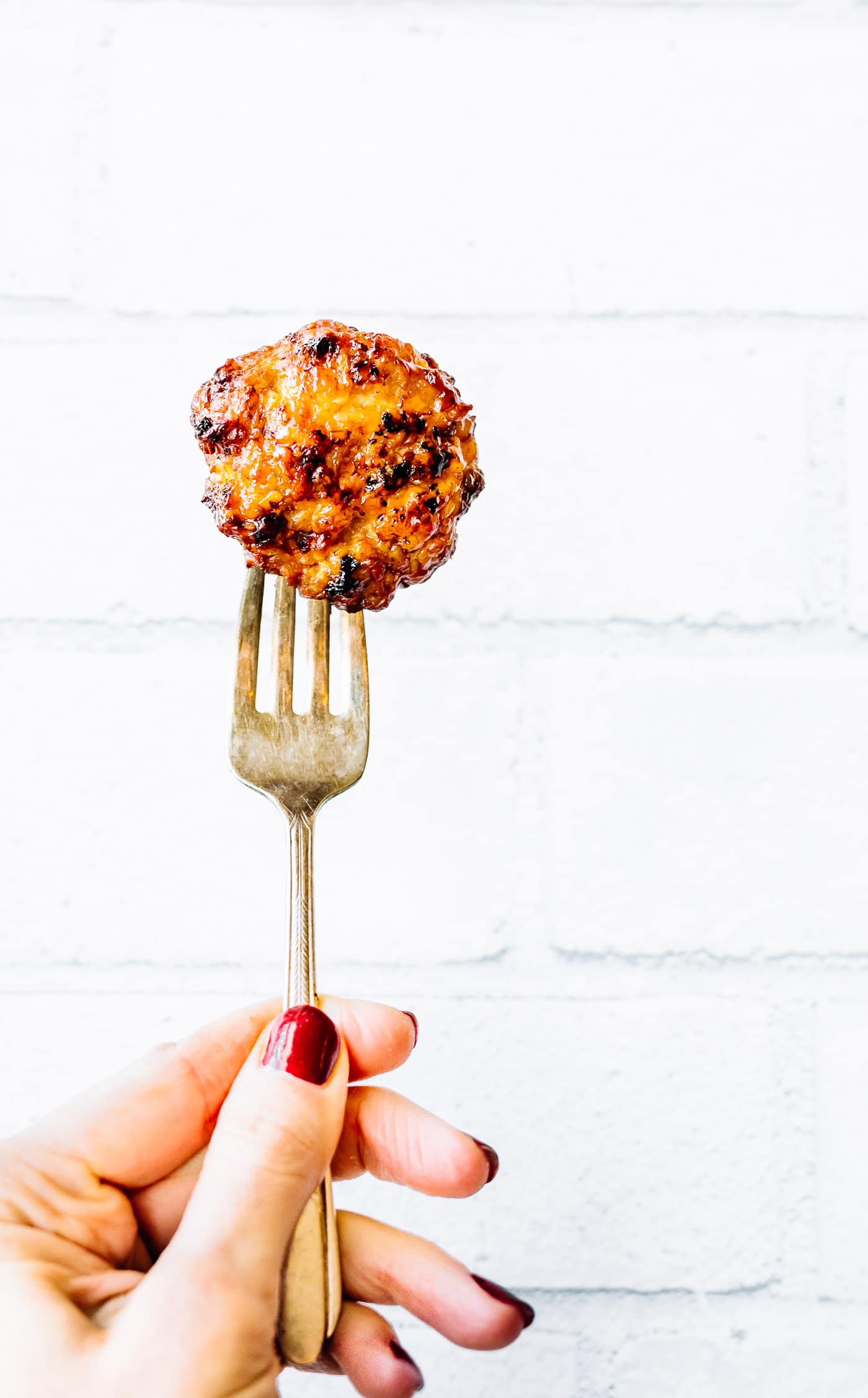 An air fried breakfast sausage on a fork