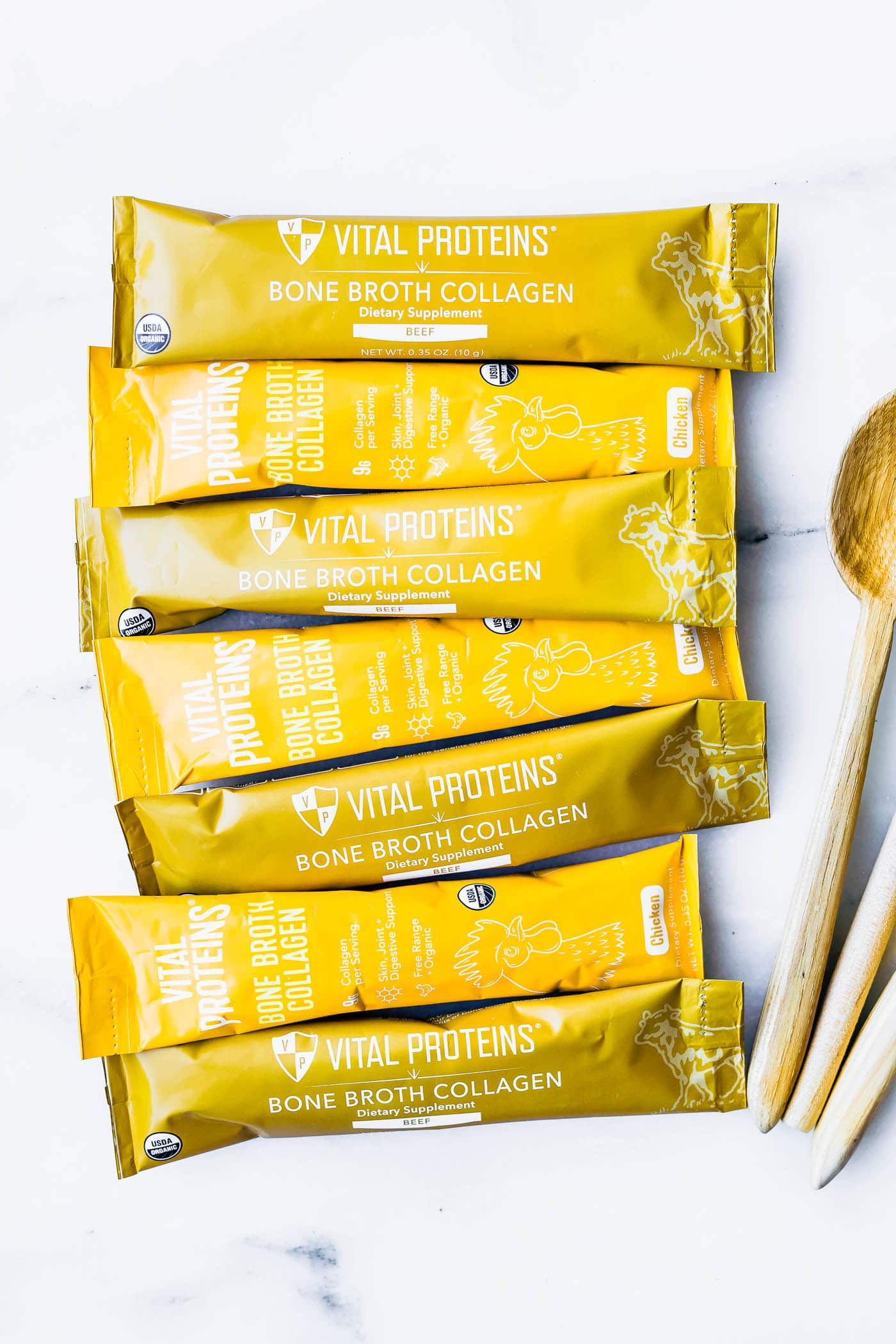 Several packets of Vital Proteins bone broth collagen lined up on a counter.