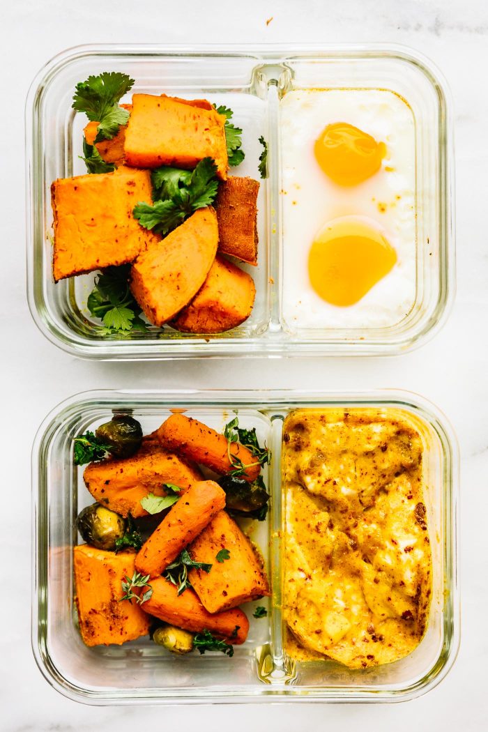 2 meal prep containers with anti-inflammatory Indian Spiced Baked Potato with Eggs