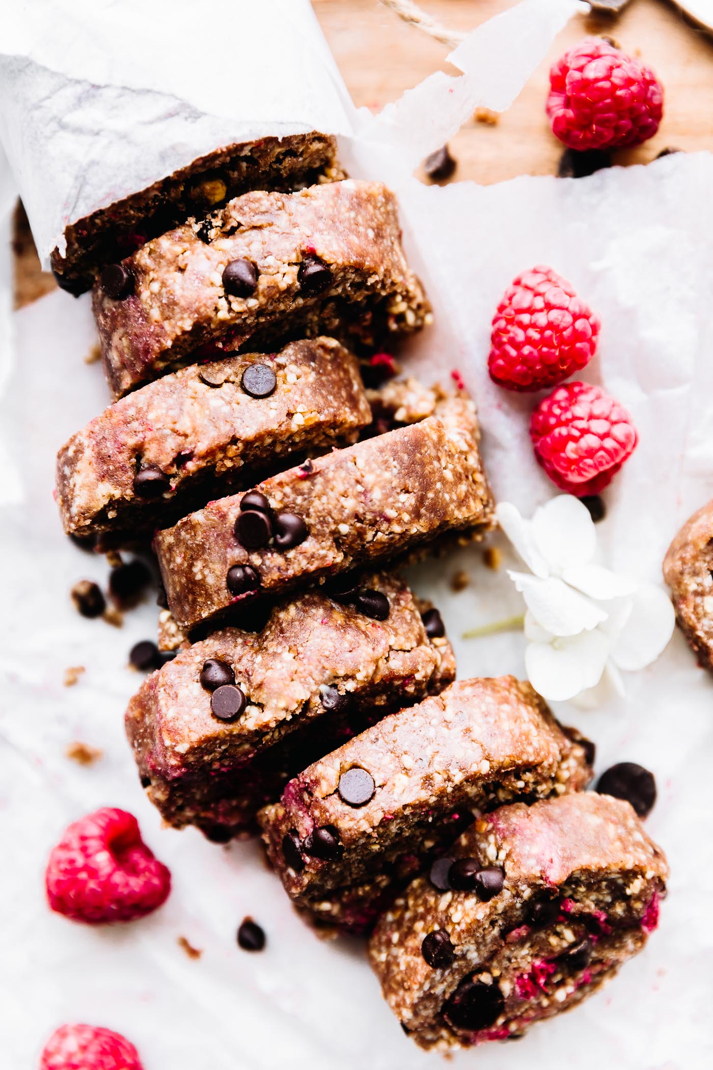 This slice and eat edible cookie dough recipe features fresh raspberries and vegan dark chocolate chips. Eggless cookie dough is a sweet treat for Valentine's Day! #cookiedough #healthy #vegan #chocolate #dessert