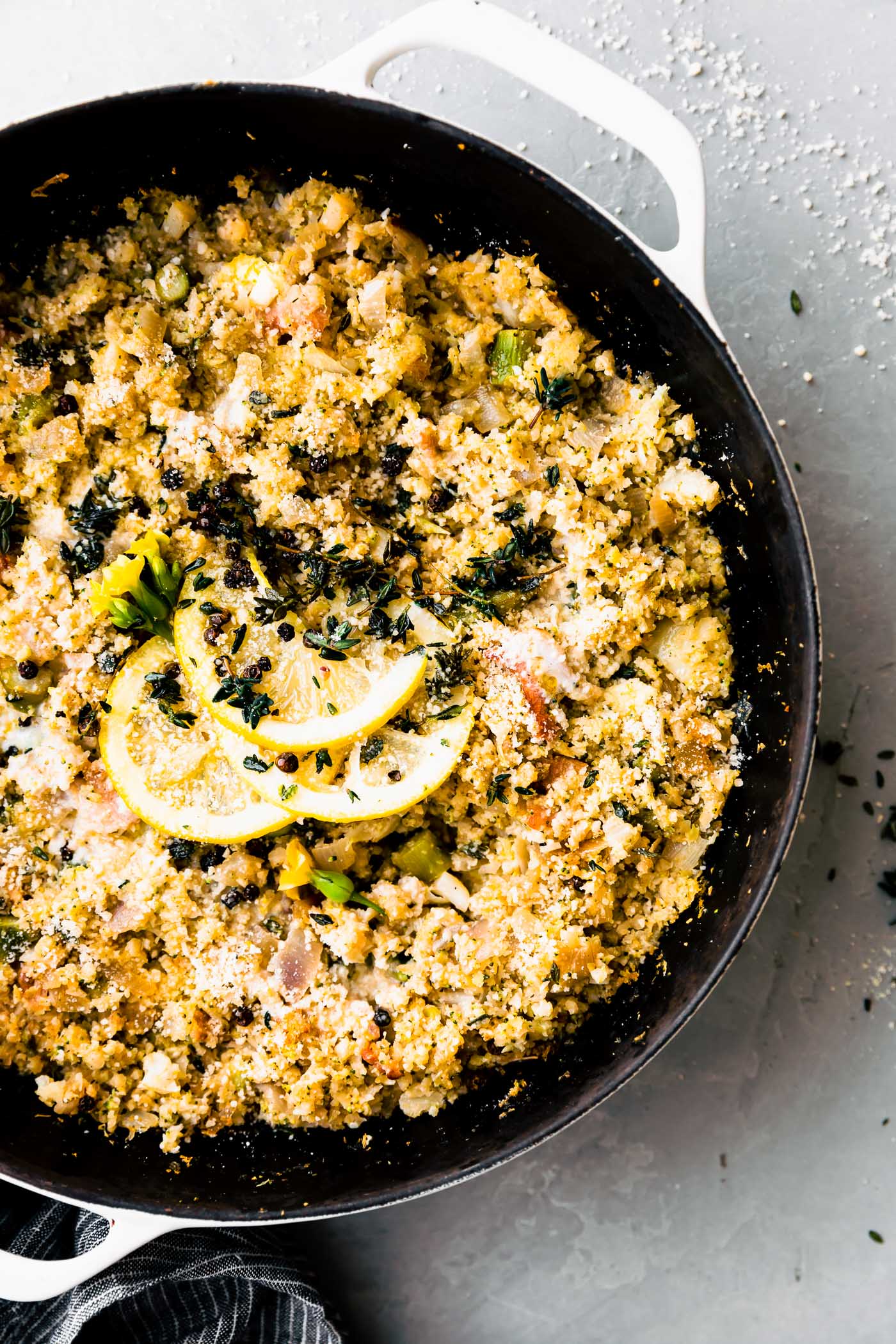 skillet of baked riced broccoli and cauliflower casserole