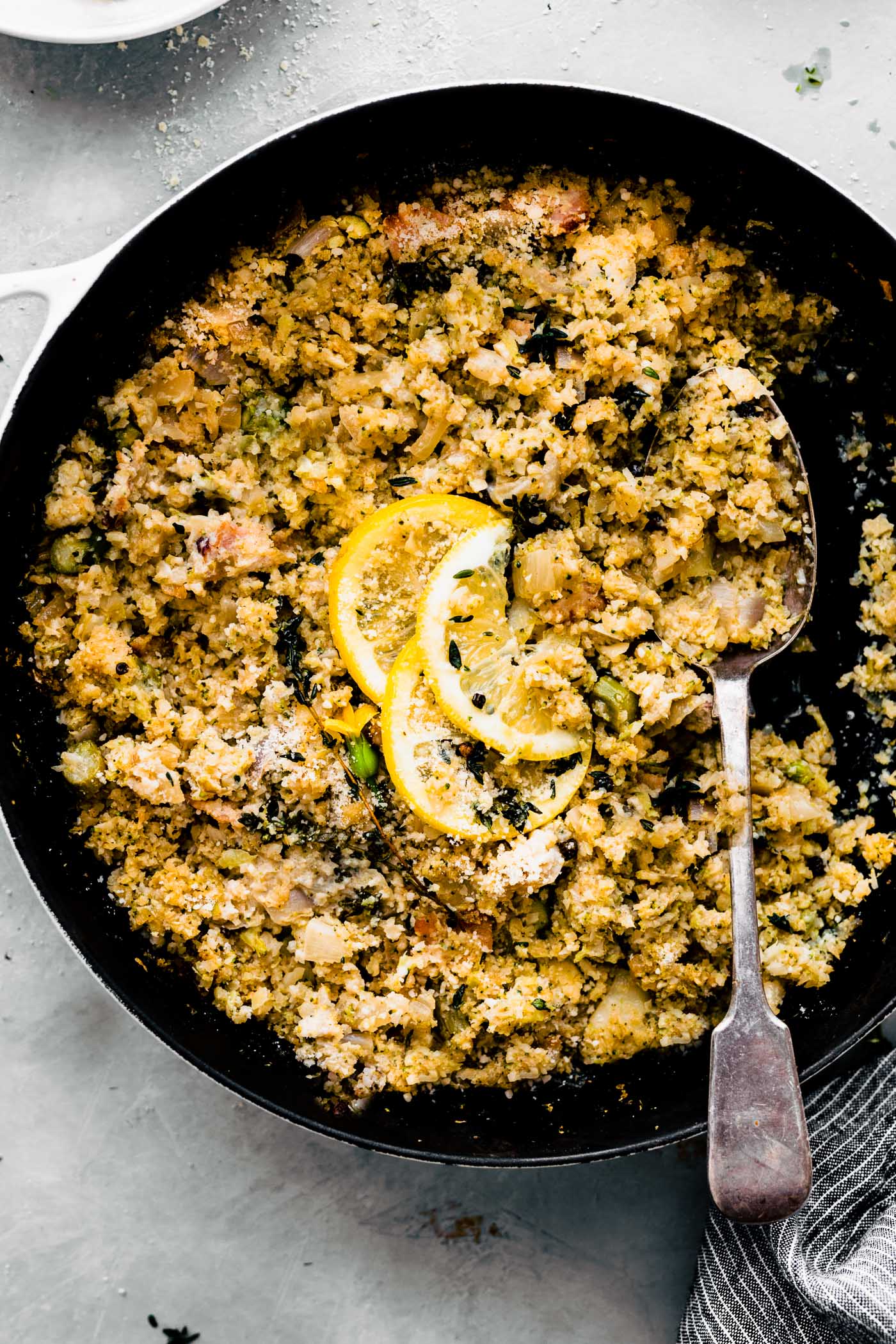 cauliflower rice risotto in pan with serving spoon