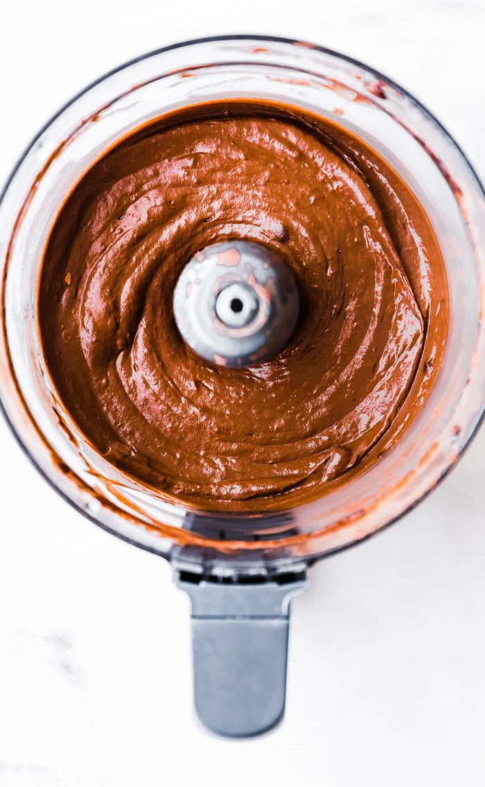 Freshly whipped Mexican chocolate mousse in a food processor bowl.