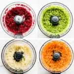 Four food processor bowls each filled with riced beets, riced broccoli, riced cauliflower, and riced carrots.