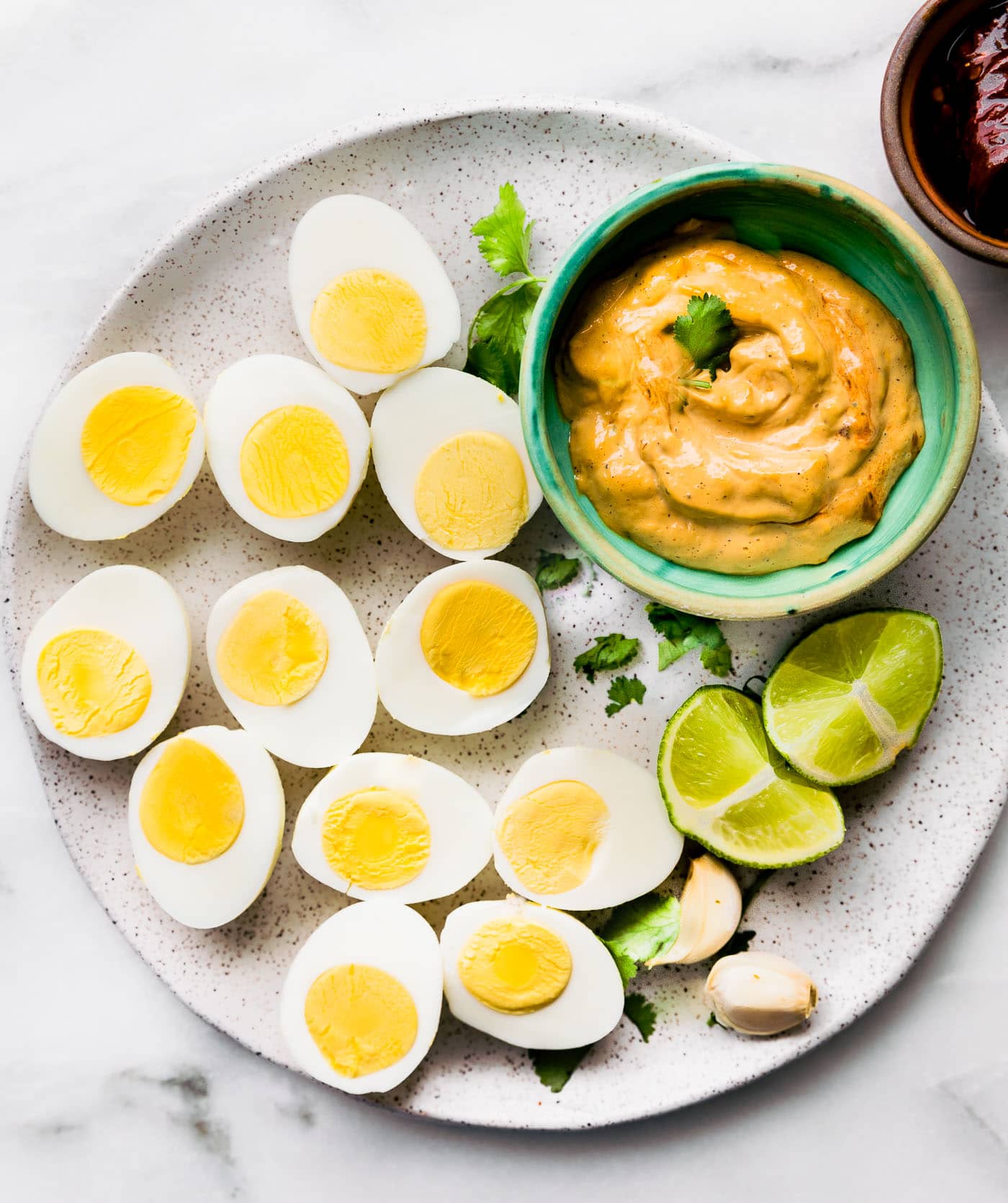All ingredients for deviled eggs with chipotle mayo.