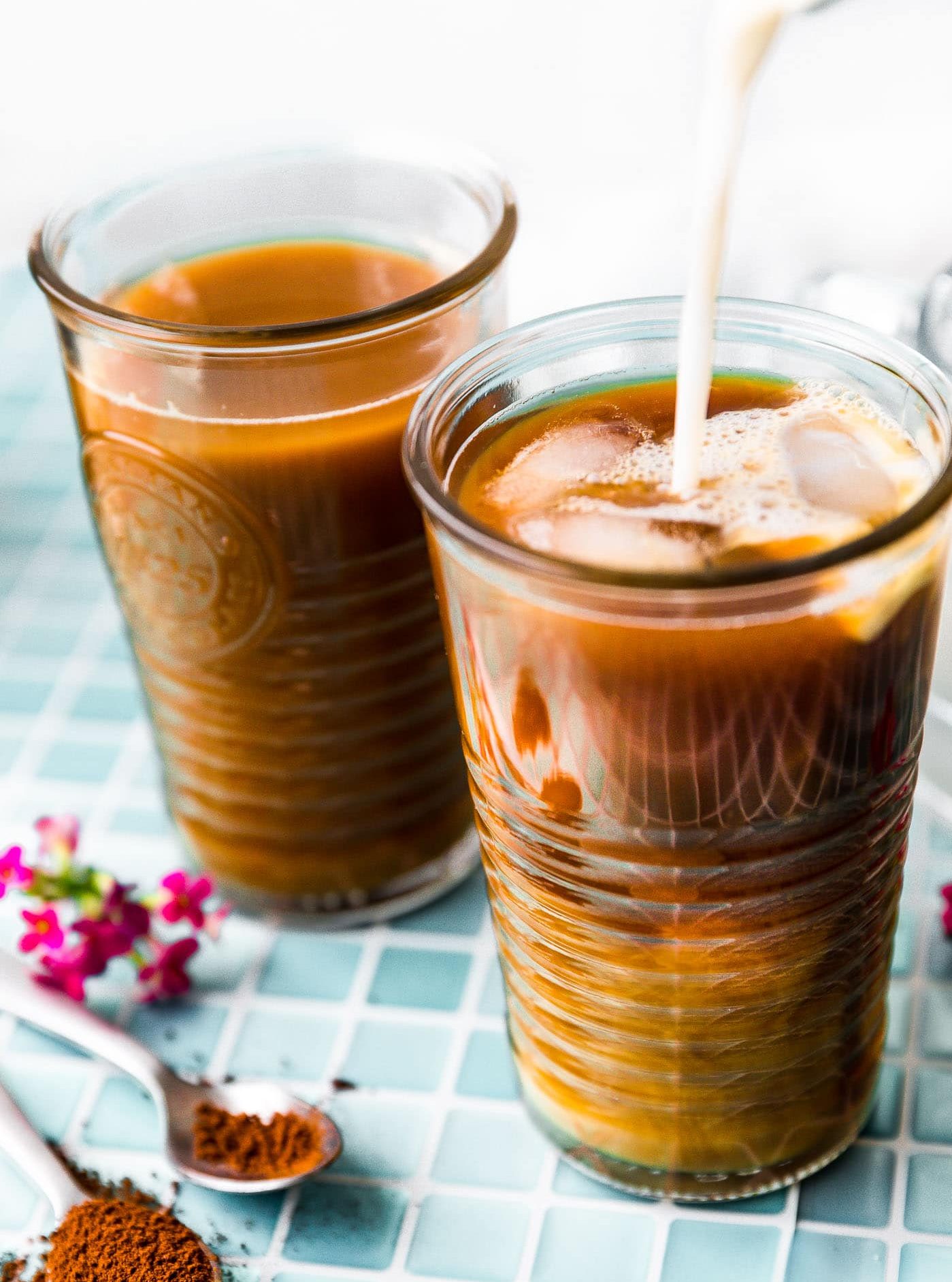 bulletproof iced coffee latte in two tall glass cups. 
