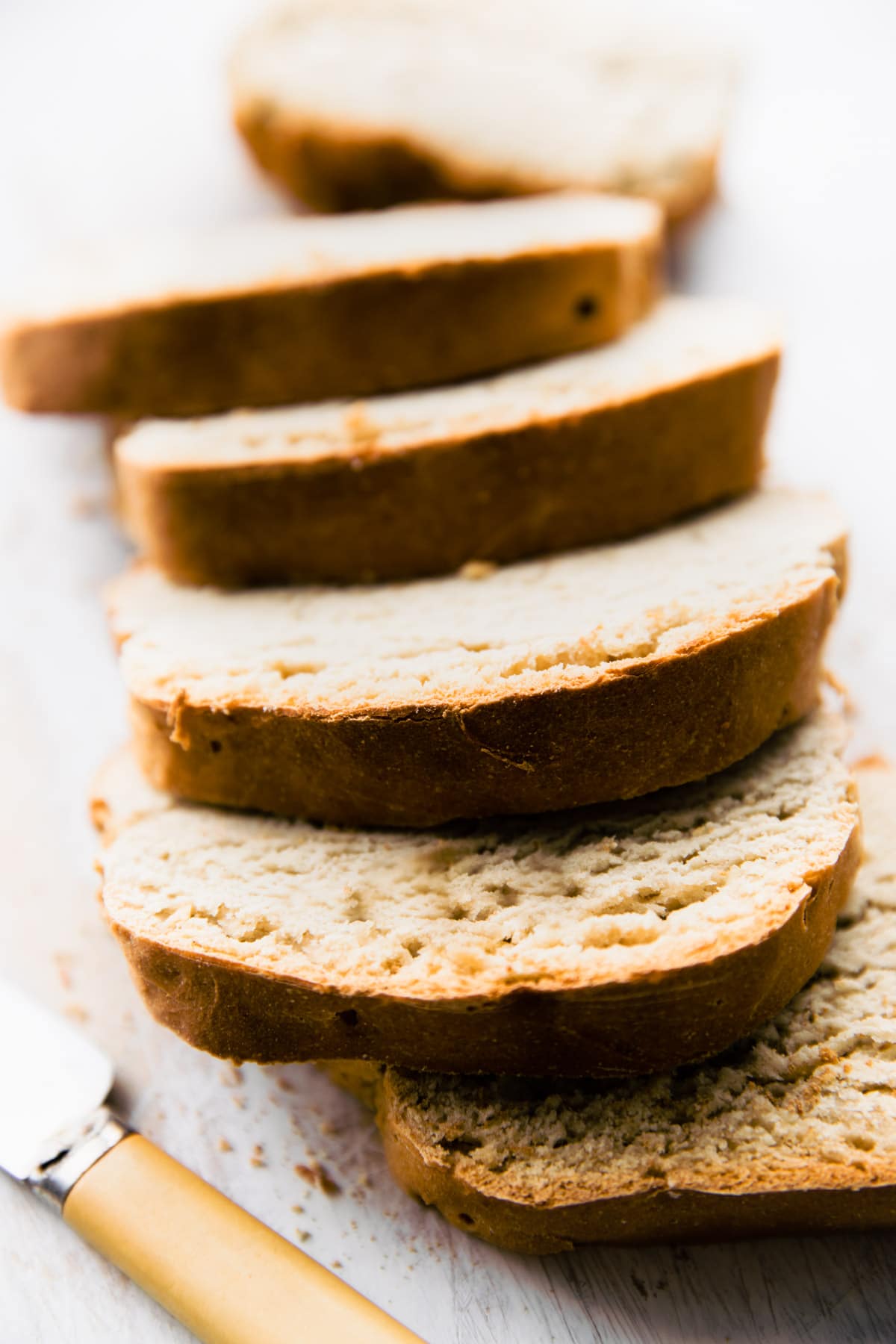 Up close photo of vegan gluten free homemade bread cut into slices.