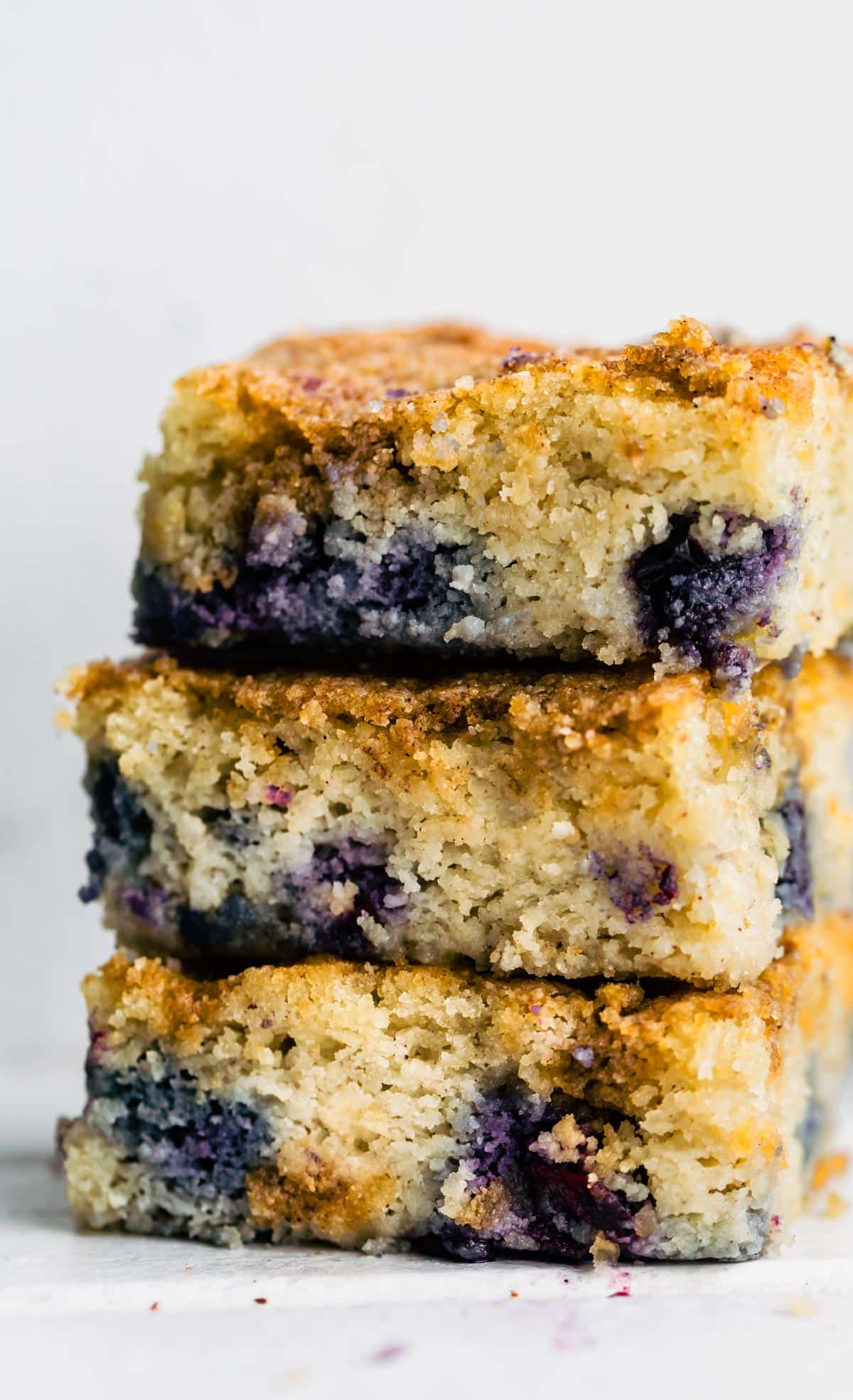 3 squares of blueberry buckle cake stacked on top of each other