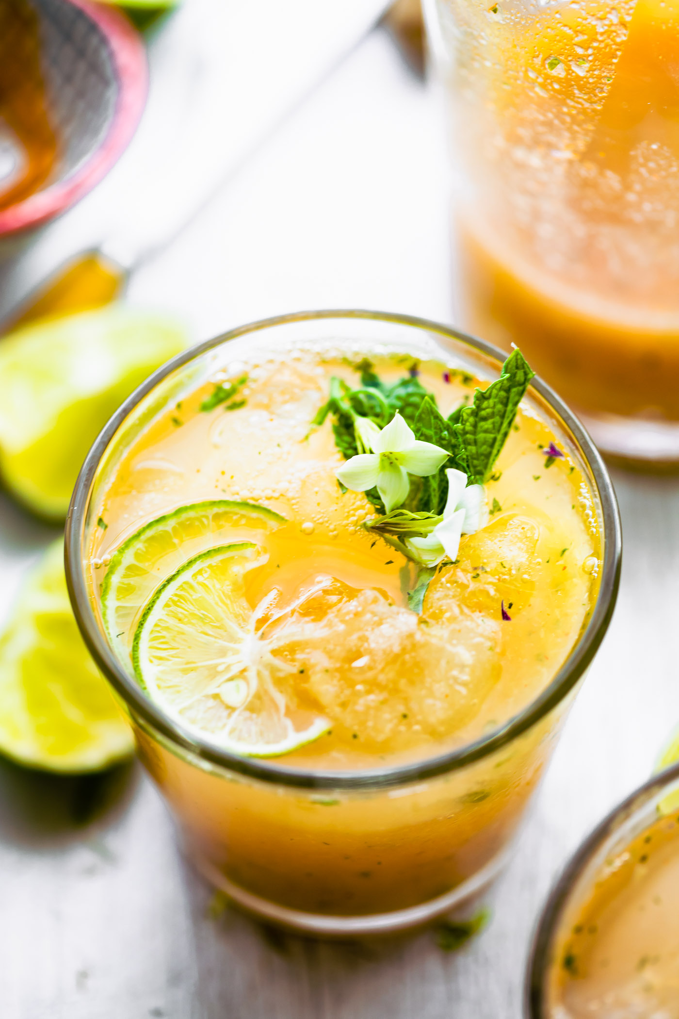 healthy apple cider drinking vinegar cocktail with turmeric, pineapple, and lime