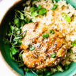 Teriyaki chicken served over rice and microgreens in turquoise bowl