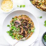 bowl of gluten free risotto with mushrooms and millet