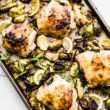 honey mustard chicken with brussels sprouts on a sheet pan