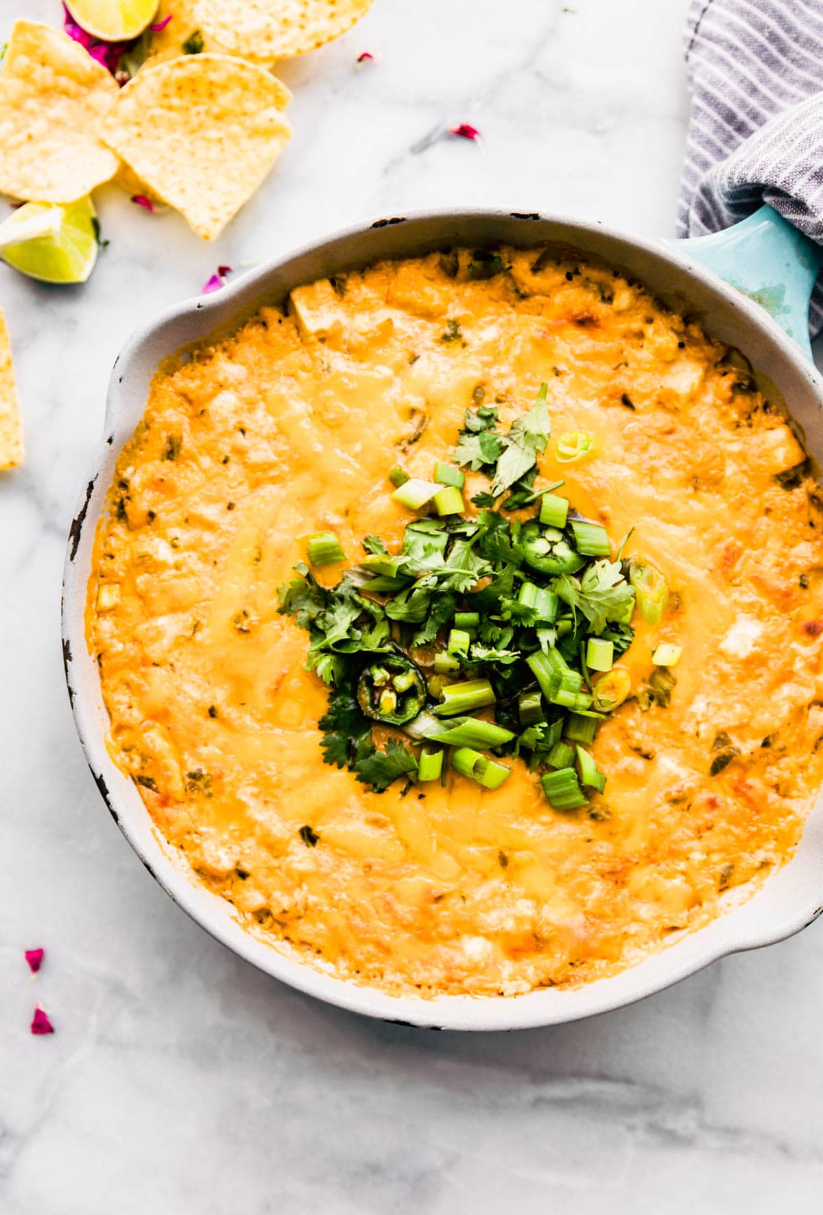 Roasted Jalapeno dip in skillet on table with chips on side