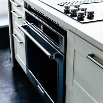 stove top and kitchenaid smart oven in kitchen island