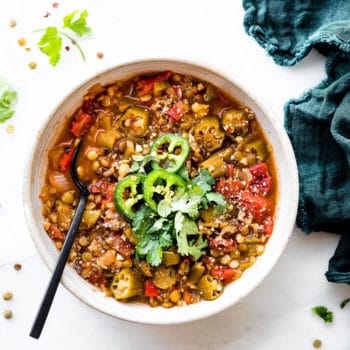 Instant pot lentil gumbo in stone bowl with black spoon