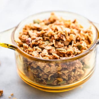 This homemade granola has buckwheat groats and is lightly sweetened with maple syrup. It's a delicious, wholesome anytime snack. Plus, it's perfect for holiday food gifts! Pair it with whatever you’d like-  yogurt, milk, dried fruit, chocolate, etc. Or, eat it by itself! This granola recipe is vegan and refined sugar free. #granola #glutenfree #vegan #homemade