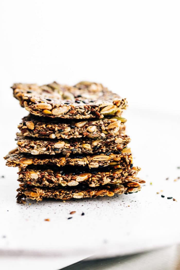 stack of homemade crackers made with 4 types of seeds
