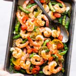 broiled shrimp and snap peas on a sheet pan