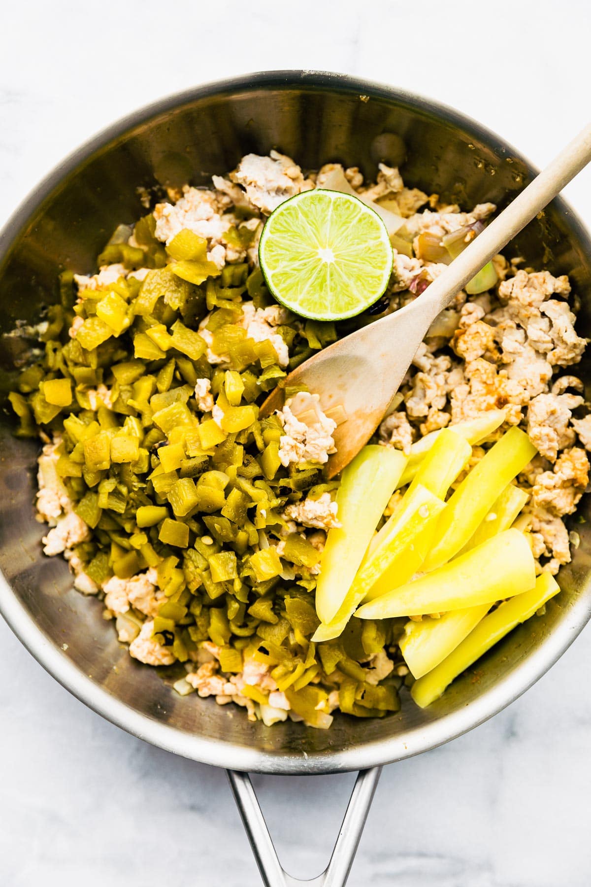 making tacos in a skillet with ground turkey and green chiles