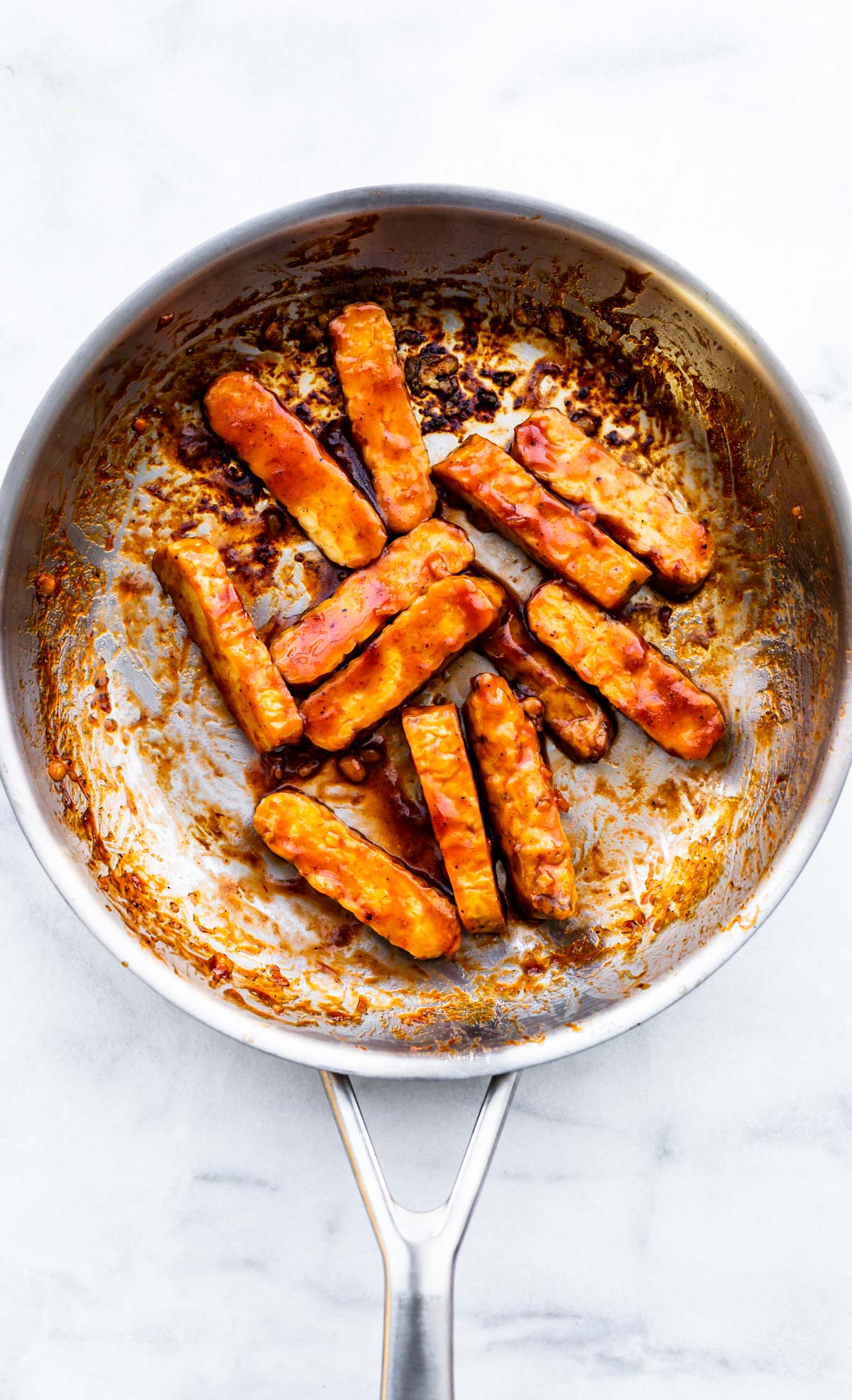 cooked and sliced tempeh in a skillet