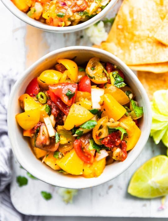 peach salsa with chipotle in cereamic bowl