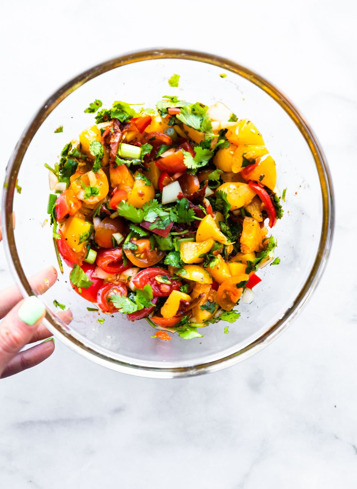 peach salsa with chipotle in mixing bowl