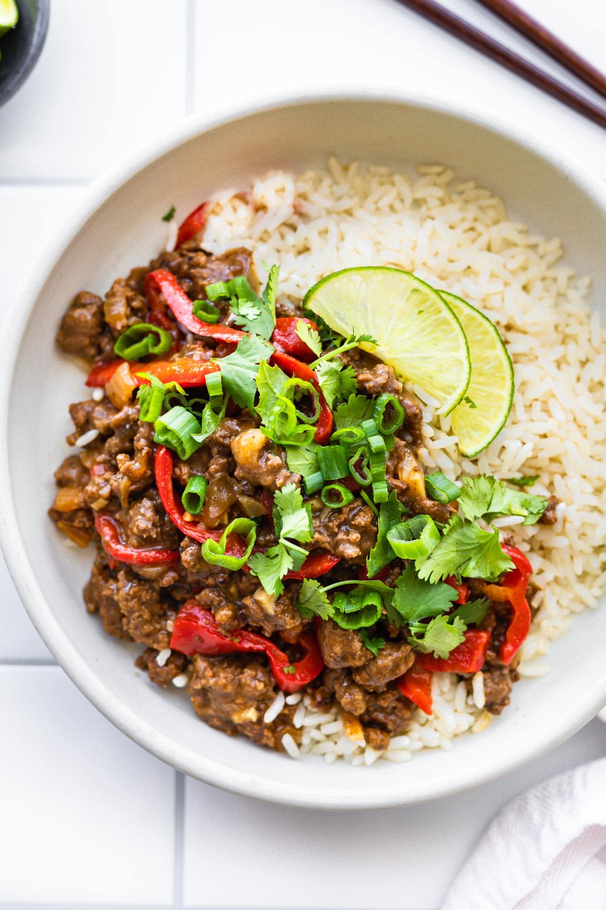 gluten free Asian beef dinner with white rice on white plate