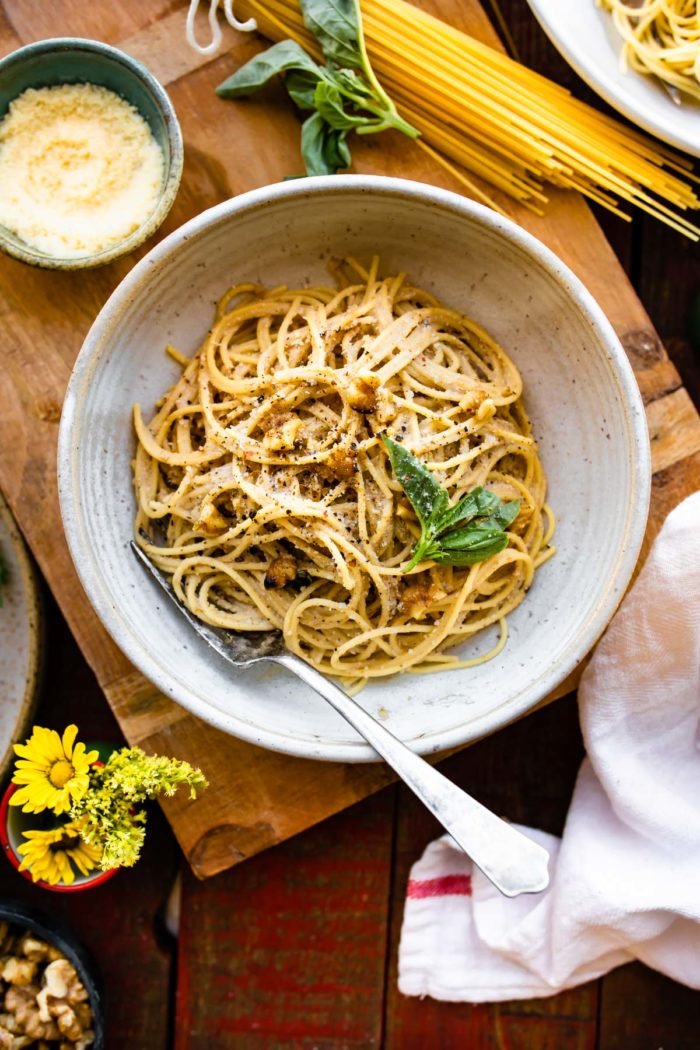 tender spaghetti with vegan pasta sauce in white bowl.