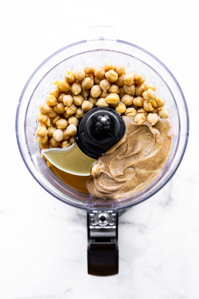 chickpeas and nut butter in food processor bowl