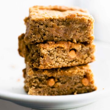stack of 3 vegan blondies on a white plate