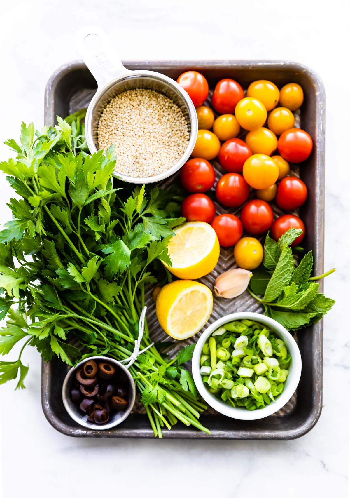 tabouli salad recipe ingredients beautifully arranged on a cutting board