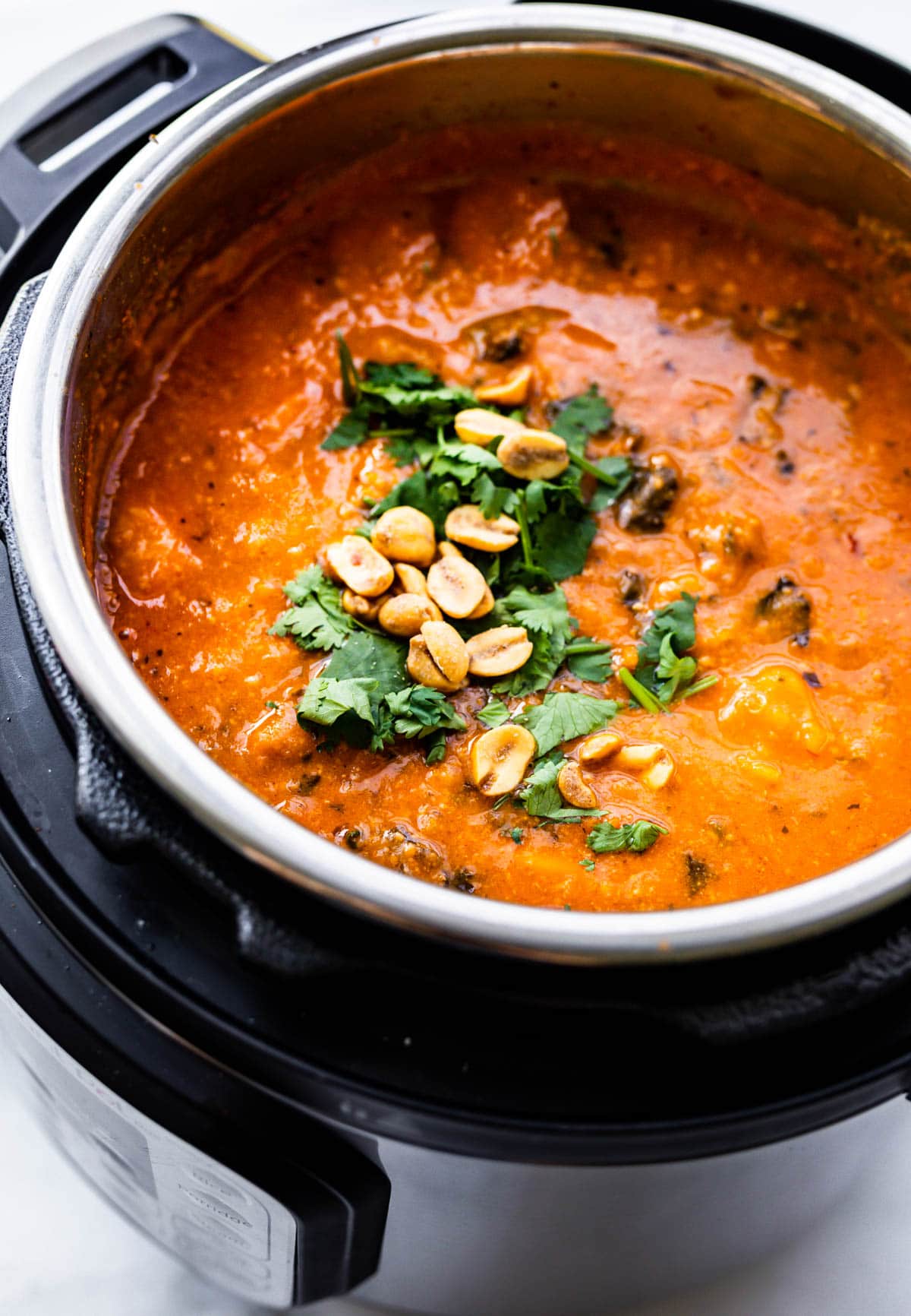 tomato-based stew with peanuts cooking in Instant Pot