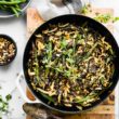 overhead image: vegan green bean casserole in a skillet