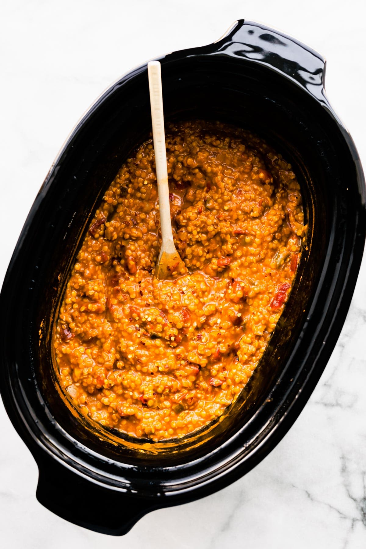 overhead: red lentil chili in slow cooker