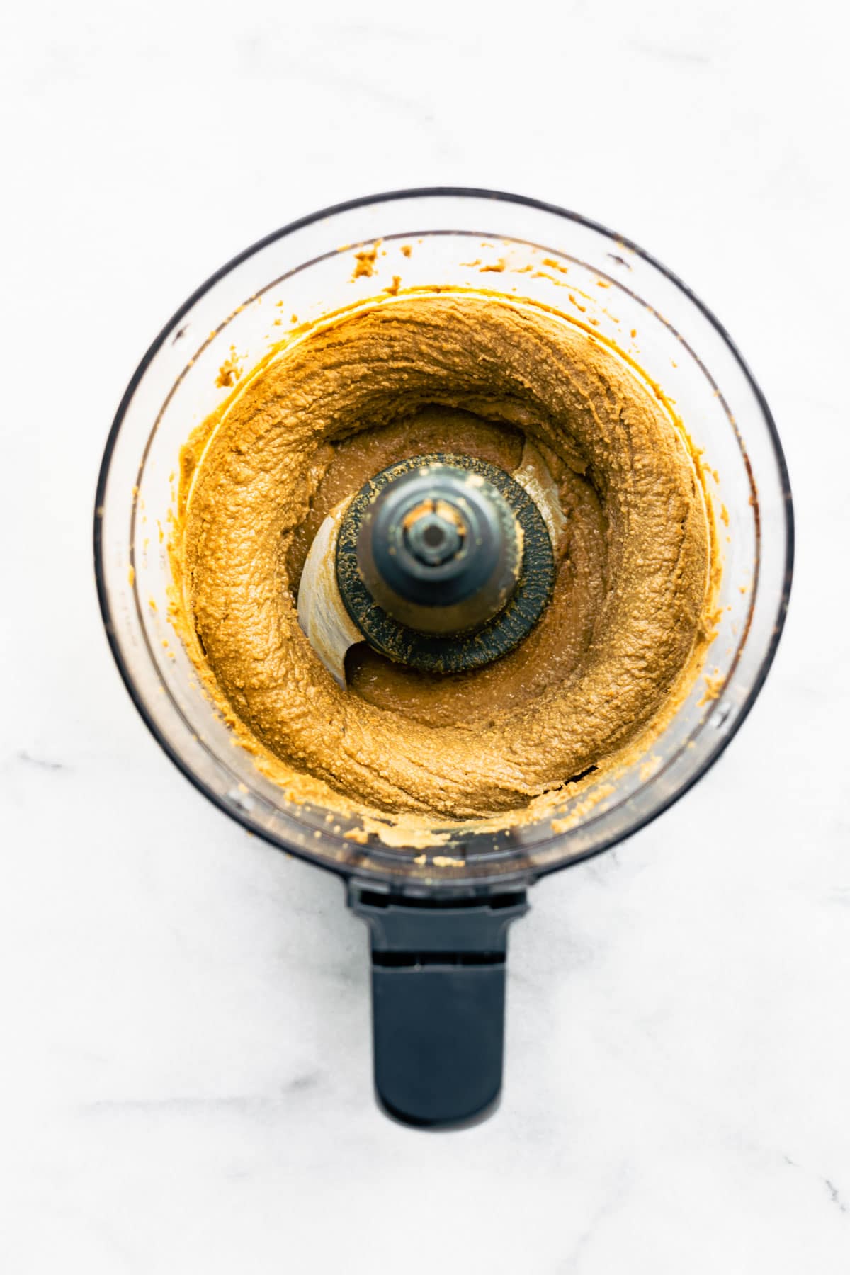 overhead: making sunflower seed butter recipe in a food processor