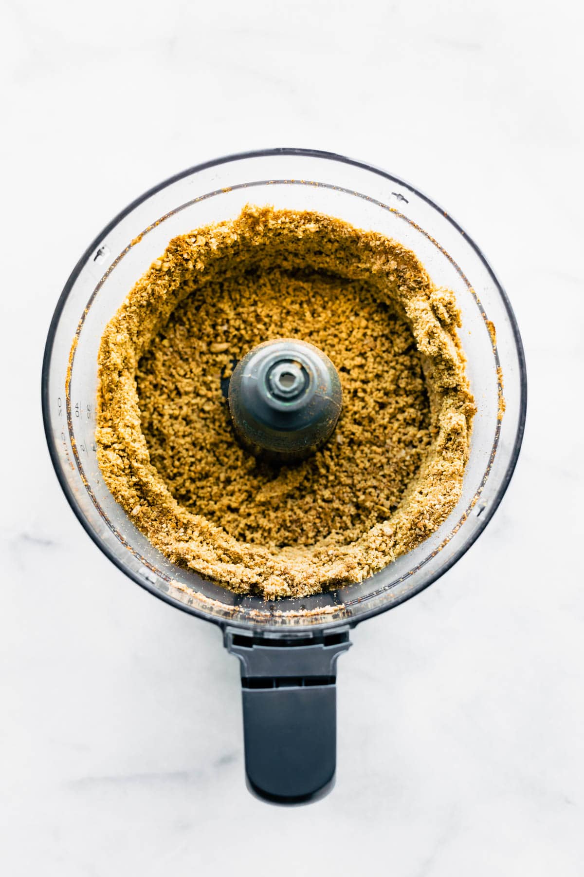overhead photo: sunflower seed butter in bowl of food processor