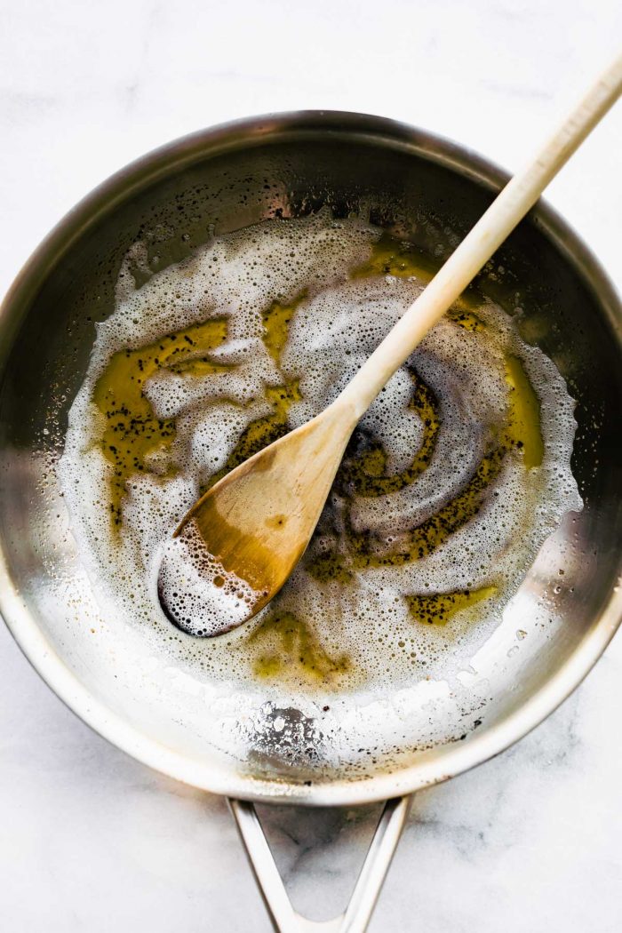 overhead image shows how to make brown butter in a saucepan
