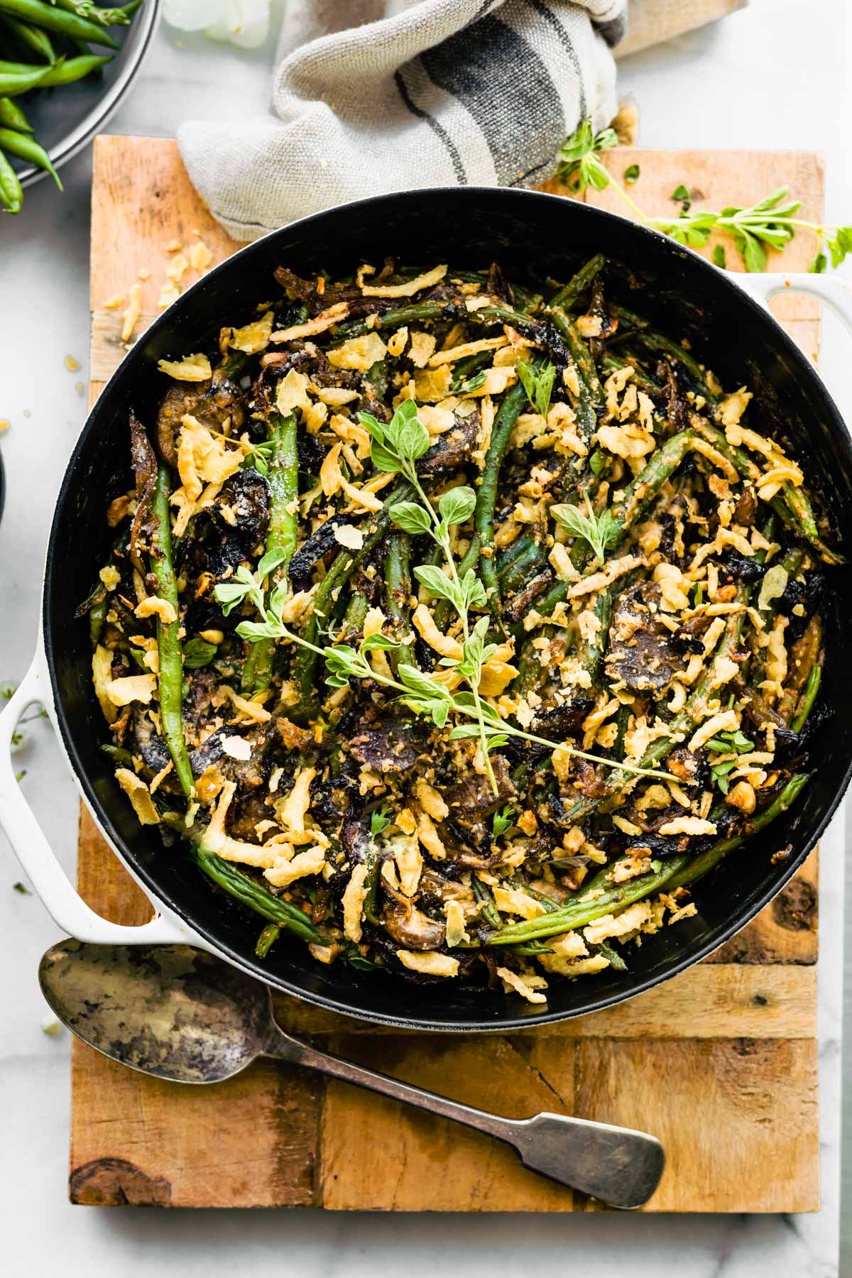 Overhead view skillet filled with baked vegan green bean casserole