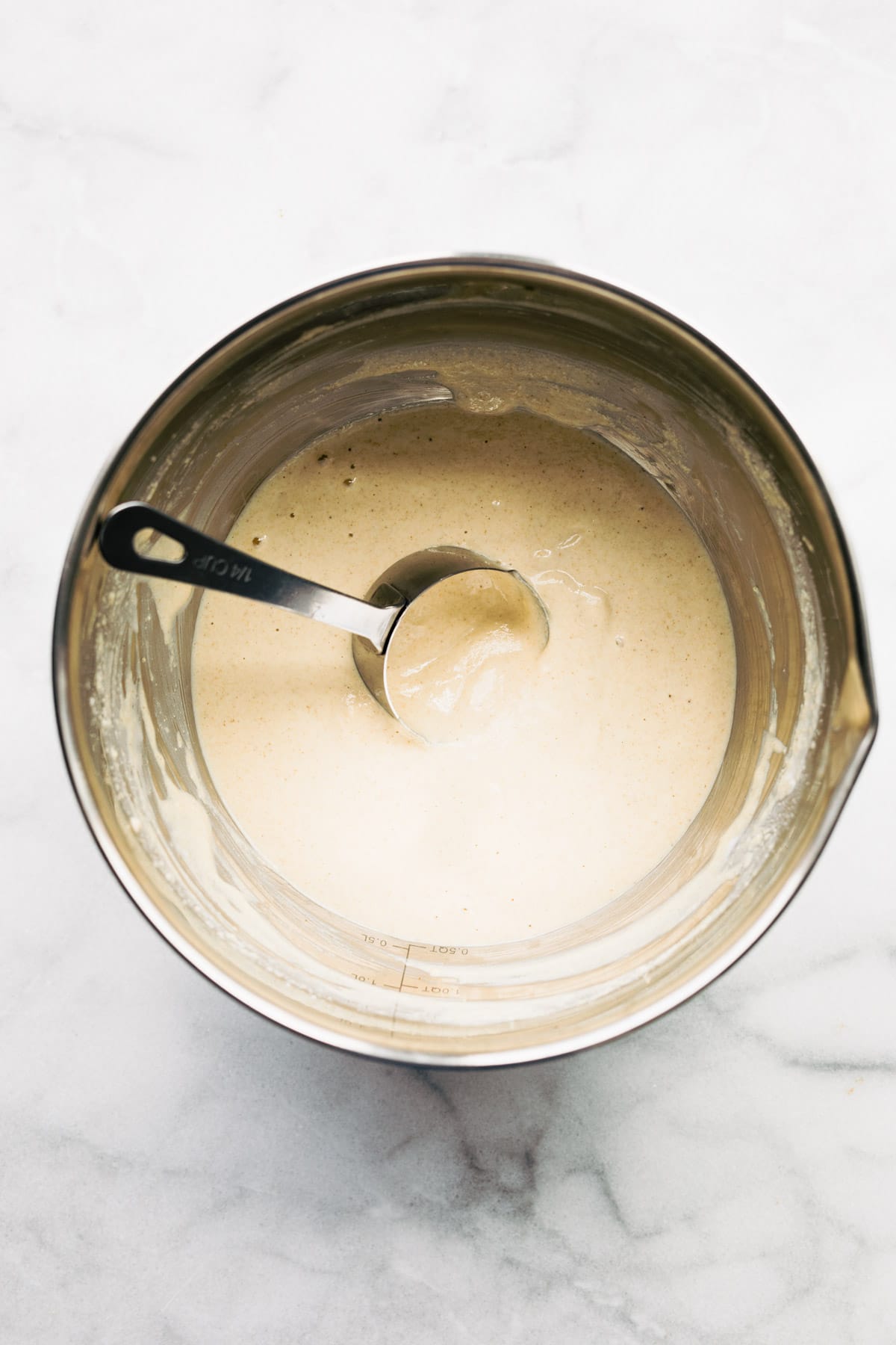 overhead photo of pancake batter in a mixing bowl