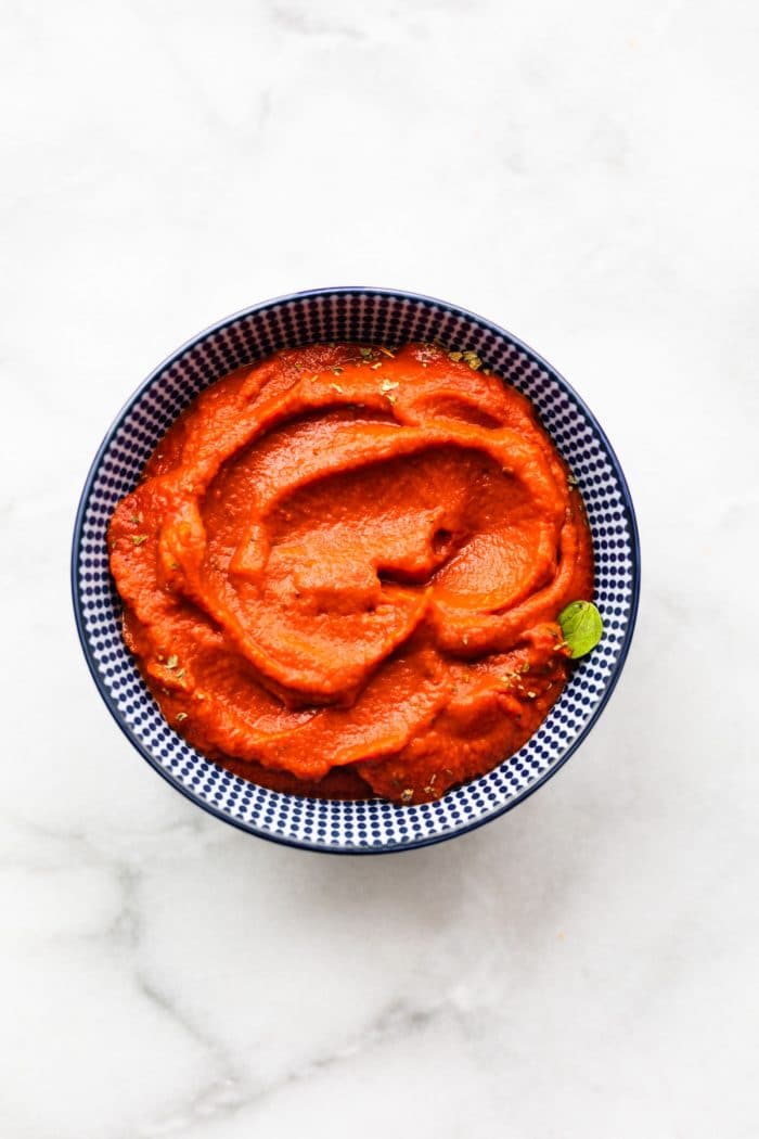 overhead photo: tomato sauce alternative in small blue bowl