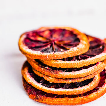 stack of dried orange slices on white background