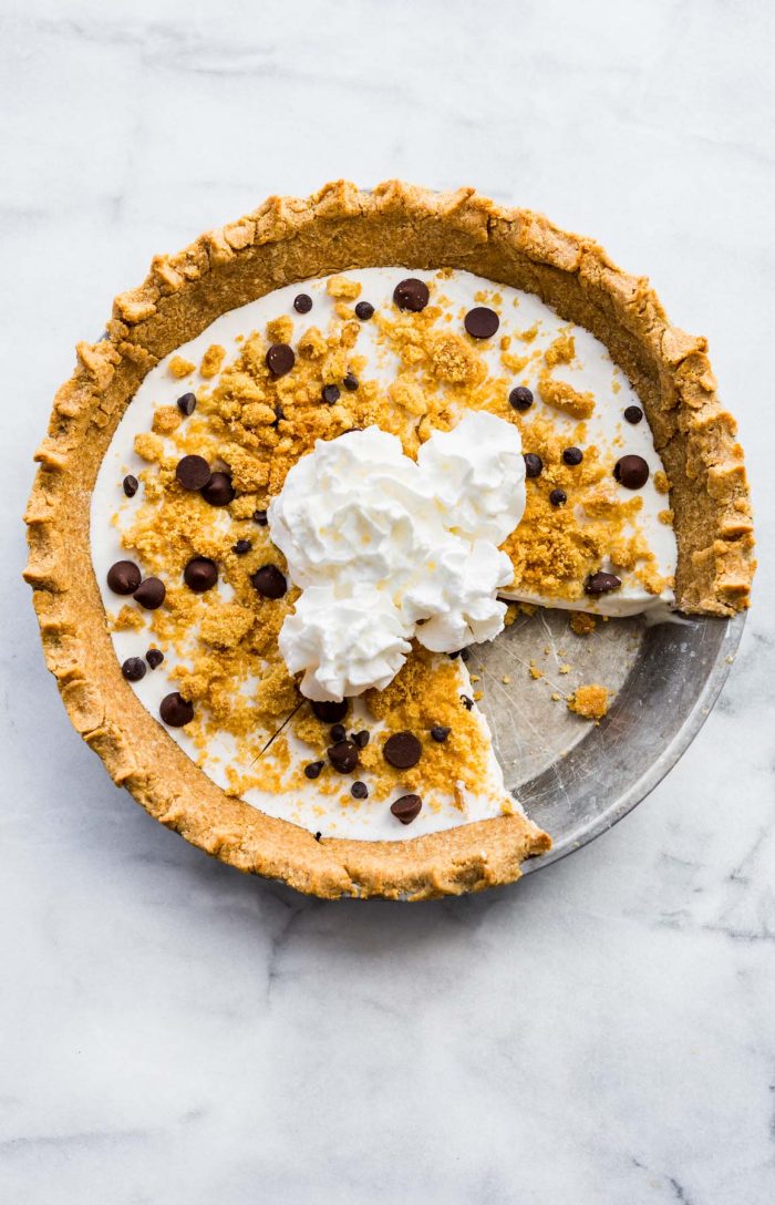 overhead image: gluten free pie topped with whipped cream