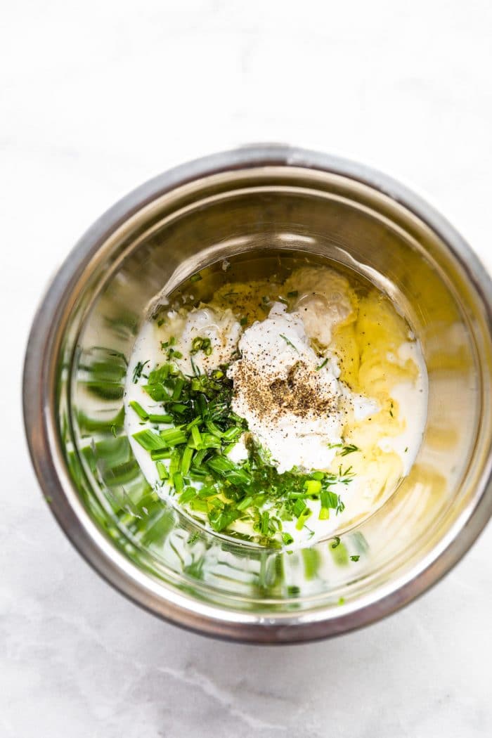 ingredients in silver mixing bowl for vegan ranch dressing recipe