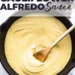 titled image for Pinterest (and shown in skillet with wooden spoon): Dairy Free Cauliflower Alfredo Sauce