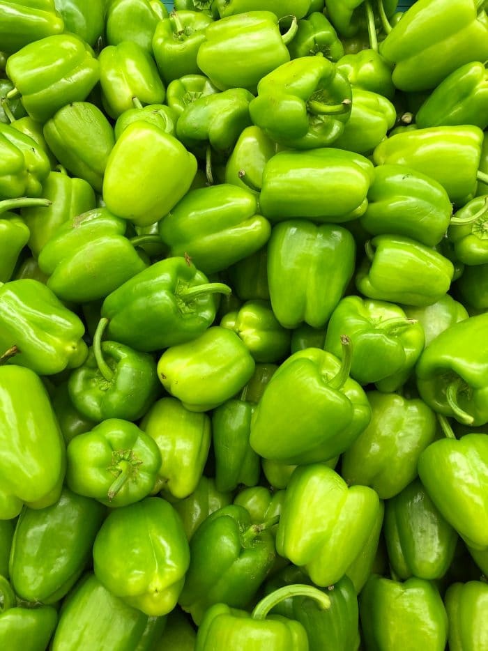 close up overhead photo of green bell peppers