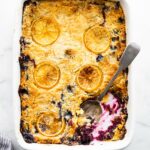 Overhead image of gluten free lemon blueberry cake in baking dish